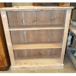 A pine open floor-standing bookcase, 102cm wide, 103cm high, an Edwardian walnut hall stand and a