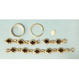 Two 9ct gold wedding bands, sizes Q and M, (sawn through), 4.2g, a garnet-set 9ct gold bracelet in