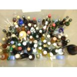 A collection of approximately eighty alcohol miniatures.
