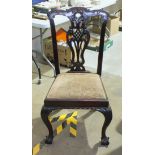 A set of four early-20th century Chippendale-style dining chairs, (4).