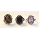 Two 9ct-gold-mounted smoky quartz-set rings and one similar amethyst-set ring, 11.3g, (3).
