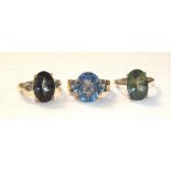 A 10ct gold ring set mystic topaz between two diamond points, 3.8g and two other 9ct gold gem-set
