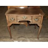 A Georgian mahogany lowboy, the rectangular top above three frieze drawers, on turned legs, 77.5cm