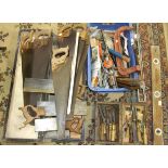 A collection of tools, including wooden planes, two braces, bits and other tools.