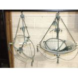 A modern Verdigris-finished metal and frosted glass hanging light fitting, 51cm diameter, 63cm high,