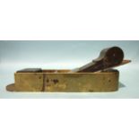 A heavy brass mitre plane with dovetailed brass sole, 24 x 5.5cm, rosewood infill and wedge and 2-