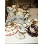 A collection of decorative 19th and early-20th century cups and saucers, a Hughes and Co. pale