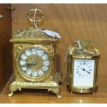 A 20th century French oval brass carriage clock, with white enamel dial escapement, (not