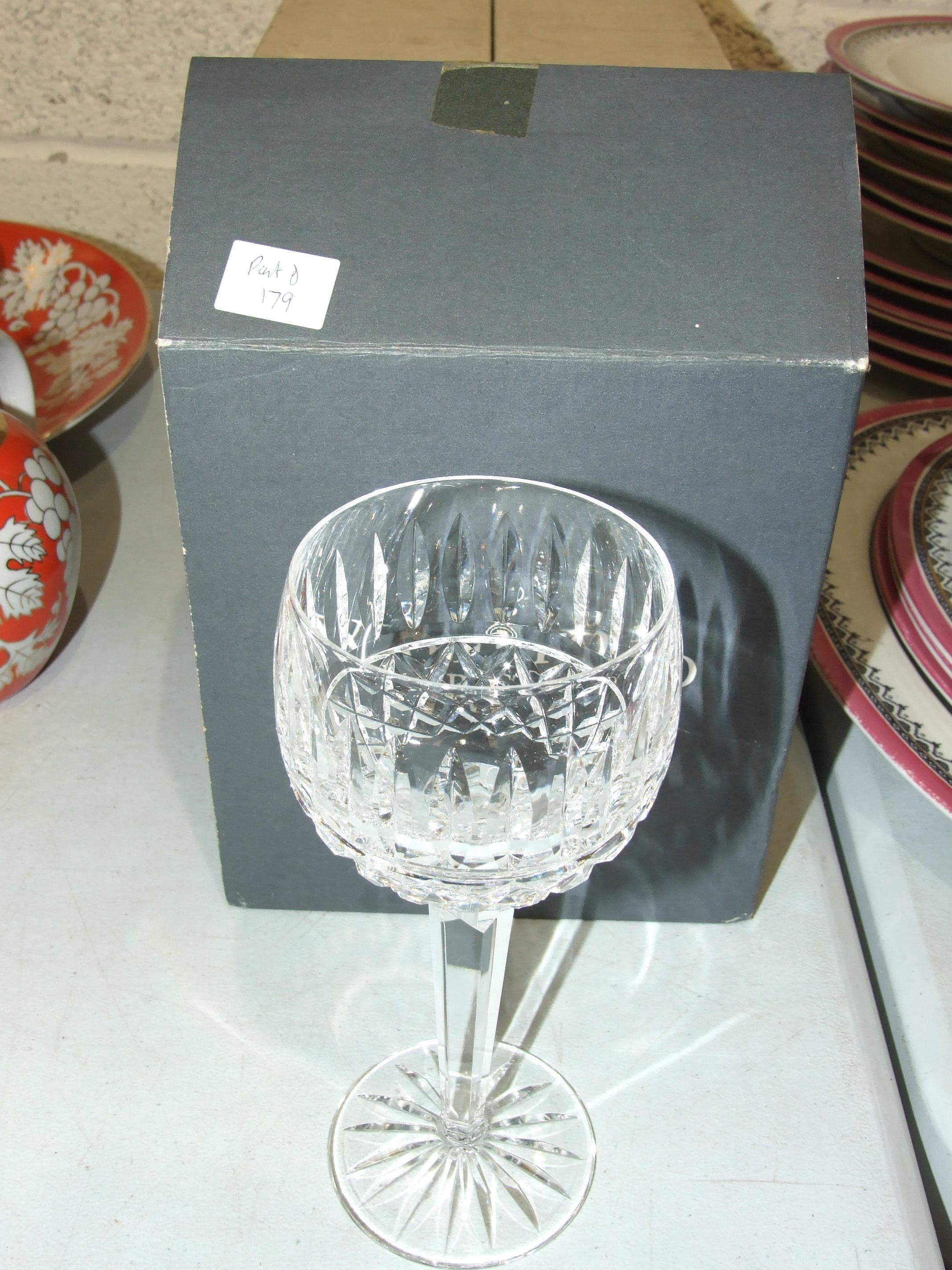 Eight Waterford crystal 'Tramore' hock glasses in two boxes and other glassware.