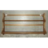 An Ercol two-shelf plate rack, 97cm wide, 50cm high.