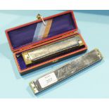 An M Hohner Super Chromica Chromatic Harmonica in original box, no.260½ and a Hero harmonica, (2).