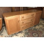 An Ercol light oak sideboard, 153cm wide, 69cm high.