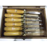 A set of six Stormont mortice chisels with boxwood handles, in home-made box.