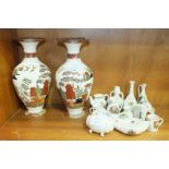 A pair of Wedgwood Etruria baluster-shaped vases with willow decoration, 23.5cm high, (chip to