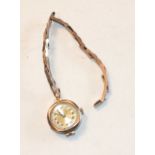 A lady's 9ct-gold-cased wrist watch on 9ct gold expanding bracelet, gross weight 15.6g.