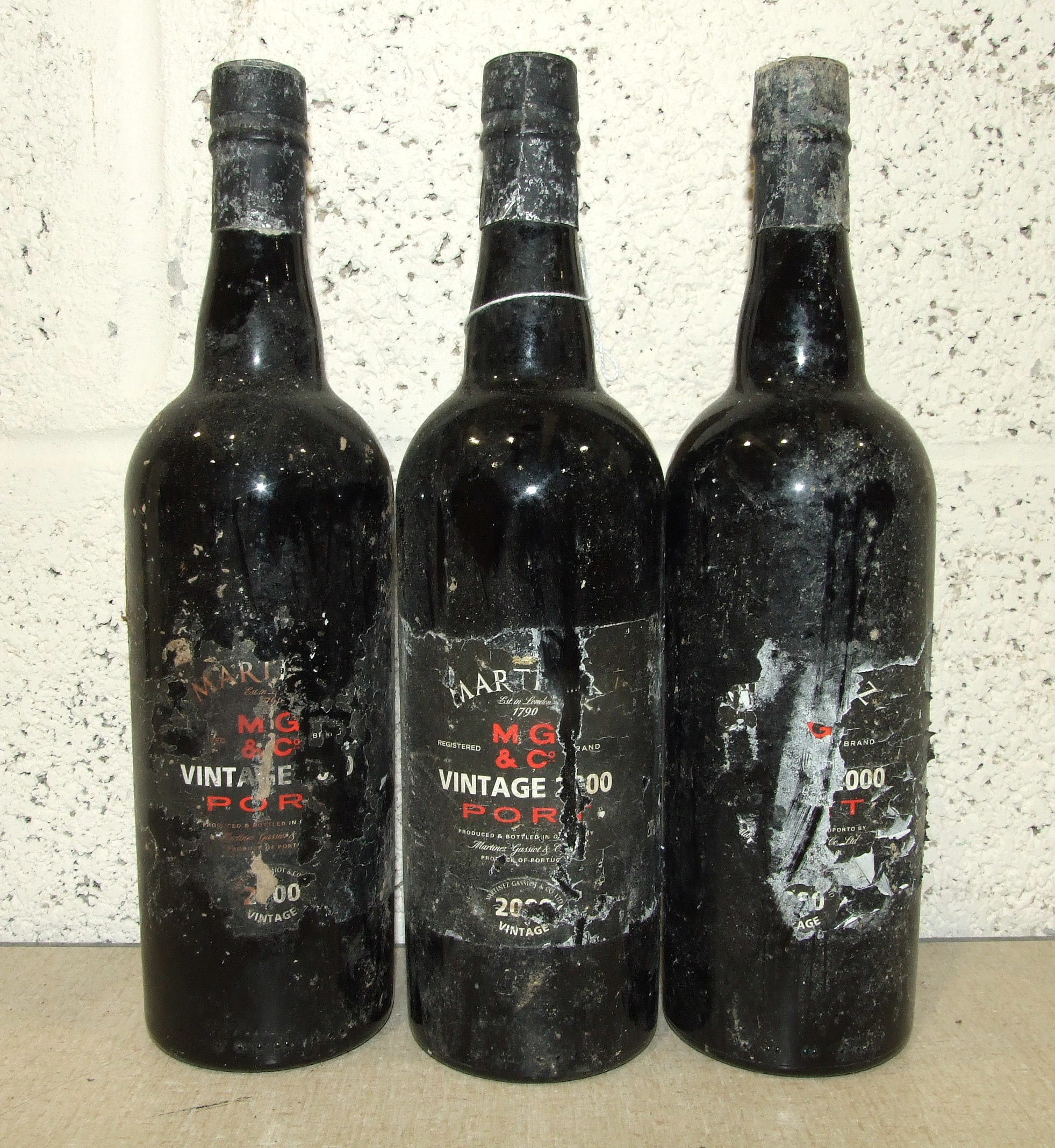 Martinez, 2000, 75cl 20%, (labels damaged, one capsule torn), three bottles, (3).