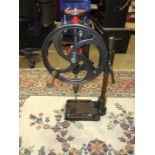 An antique cast iron pillar drill, 60cm high.