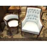 An Edwardian button-back upholstered tub armchair on square tapered front legs and a similarly-