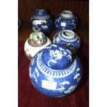 An early-20th century blue and white prunus-decorated ginger jar and cover, 20cm high, four