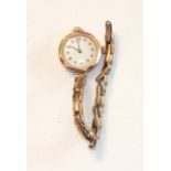 A lady's 9ct-gold-cased wrist watch on 9ct gold expanding bracelet, gross weight 20.6g, (not