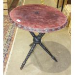 A late-19th century circular-top ebonised gypsy table, on turned cross-form legs united by a turning