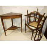 An Edwardian inlaid rosewood corner table on square tapered legs with serpentine under-tier, 65cm