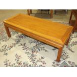 A 20th century Hong Kong hardwood coffee table, 128 x 50cm, 40cm high.