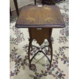 An Art Nouveau-style hardwood plant stand, the top inlaid with birds, on shaped legs and stretchers,