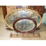 A large oval gilt frame mirror, 118 x 80cm, (some damage), two wood frame mirrors and other items.