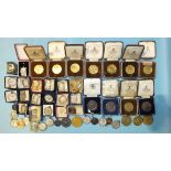 A collection of metal 'Plymouth Society of Music' medallions, cased, mainly 1930's and other music