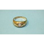 A 9ct gold gypsy ring set three opals and four diamond points, size K, 2.8g.