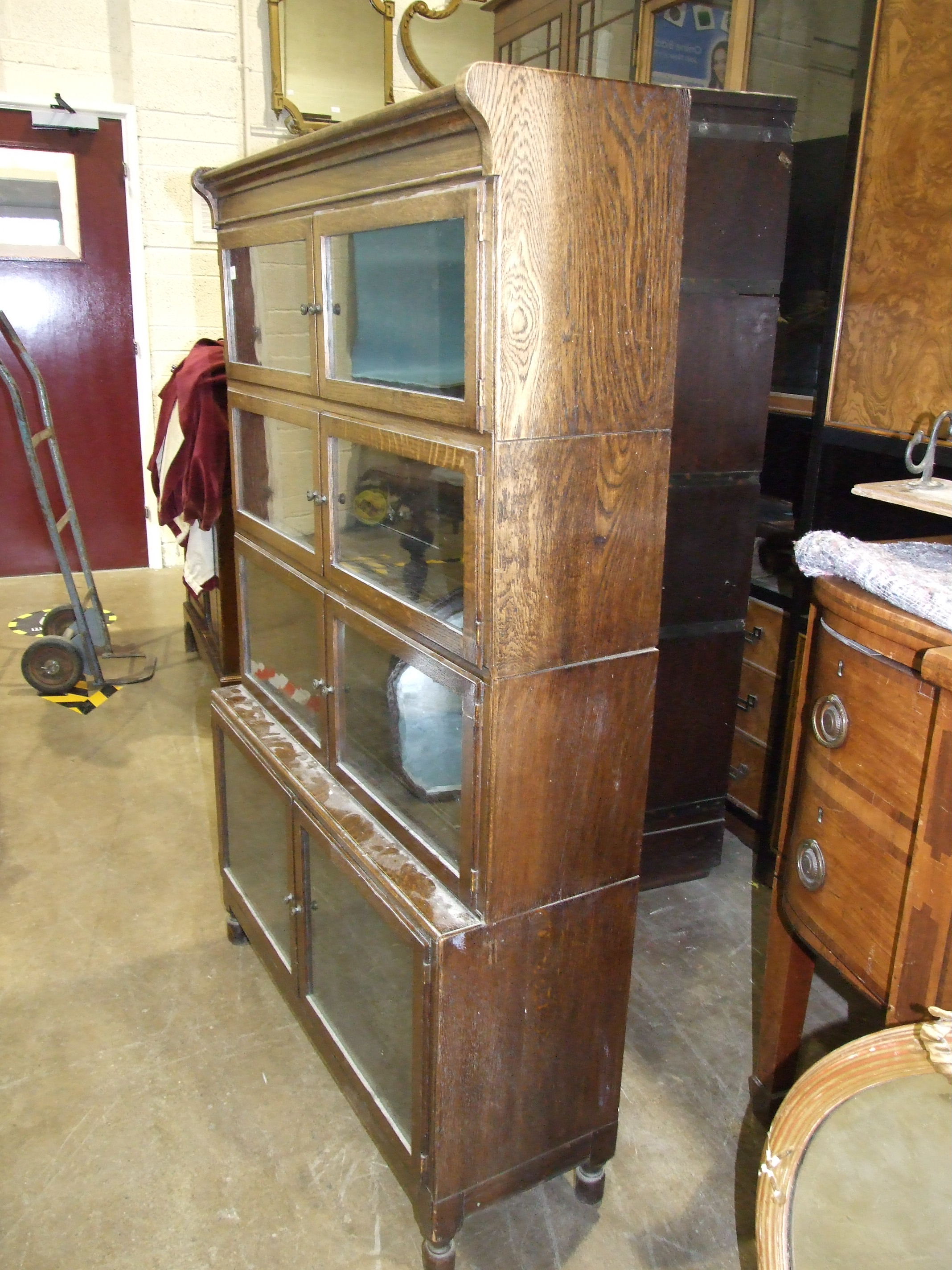 A Minty's of Oxford oak four-tier bookcase with hinged side-opening doors, 90cm wide, 145cm high. - Image 3 of 5