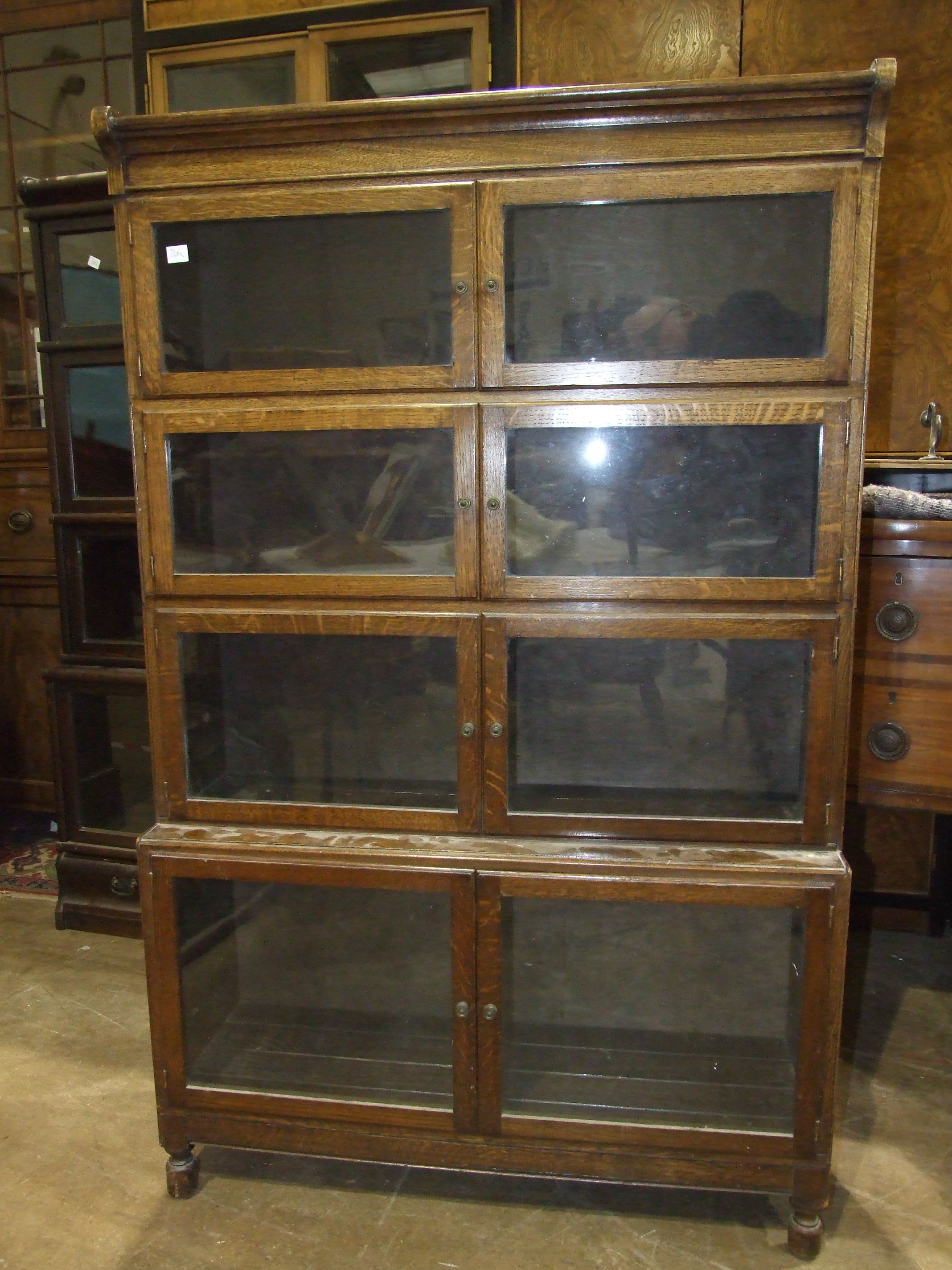 A Minty's of Oxford oak four-tier bookcase with hinged side-opening doors, 90cm wide, 145cm high. - Image 2 of 5