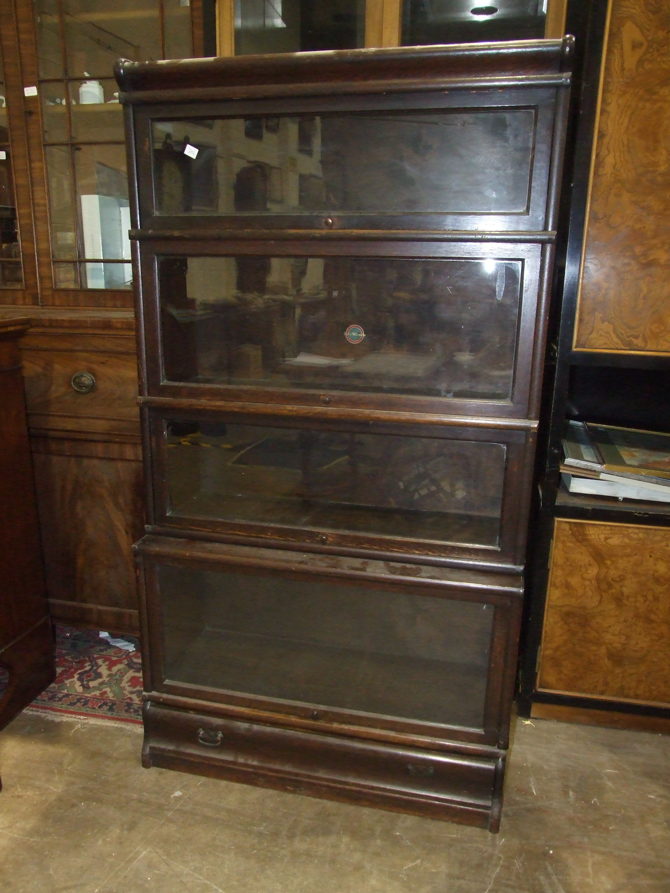 An oak four-tier Globe Wernicke bookcase, with up-and-over glass doors and drawer beneath, 87cm - Image 3 of 3