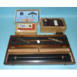 A Ministry of Defence bronze parallel rolling rule, patent 160100 in fitted box, an old ebony and