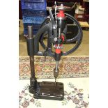 An antique cast iron pillar drill, 60cm high.