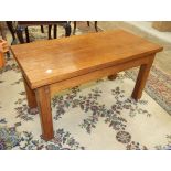 A modern craftsman-built hardwood rectangular coffee table on short chamfered legs, 42cm wide,