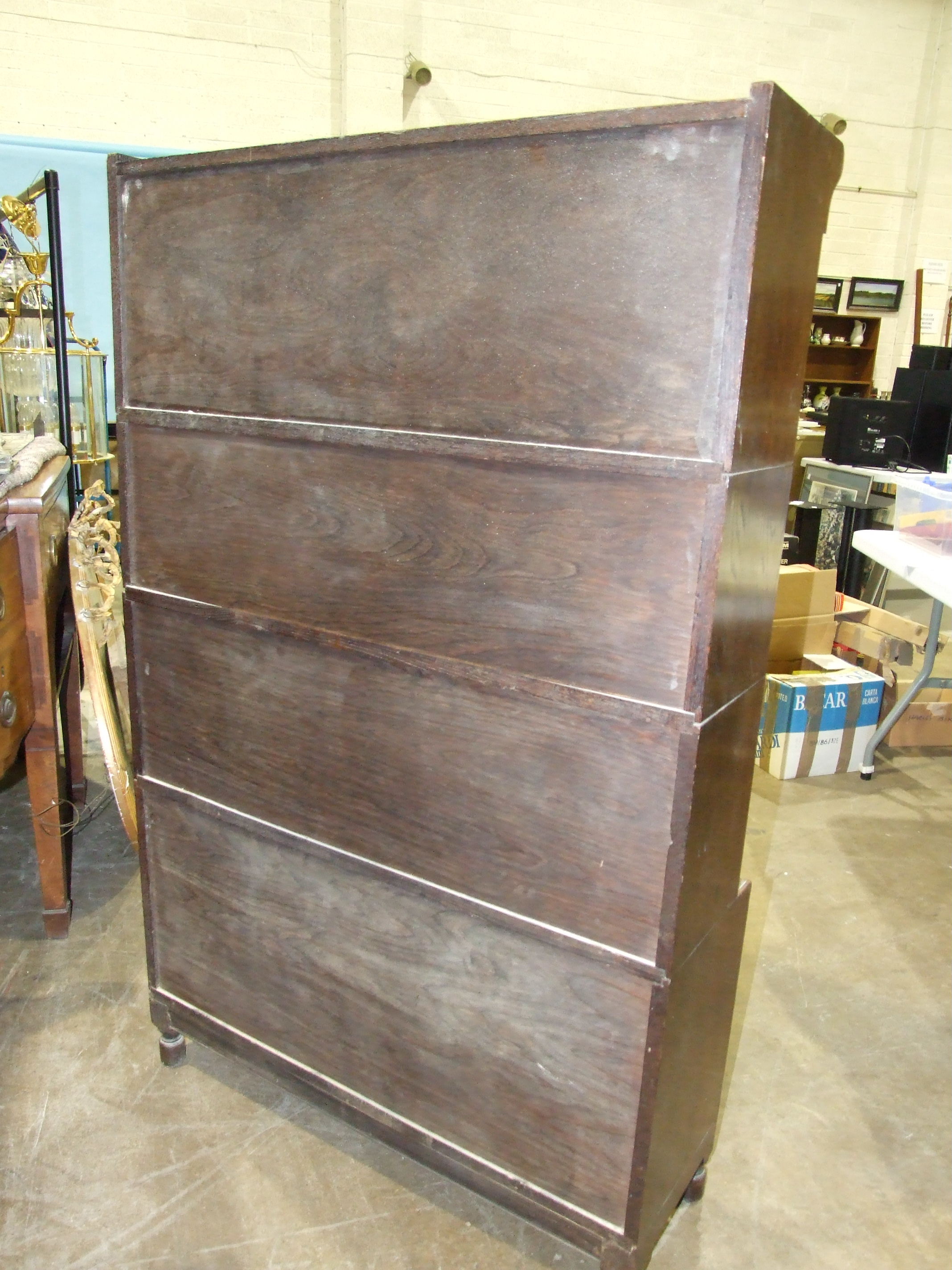 A Minty's of Oxford oak four-tier bookcase with hinged side-opening doors, 90cm wide, 145cm high. - Image 5 of 5