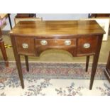 A Georgian-style mahogany small bow-fronted knee-hole dressing table, on tapered legs, 99cm wide,
