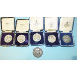 A collection of five silver 'Plymouth Competitive Musical Festivals' medallions and an unmarked