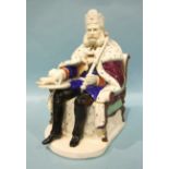 A 19th century Continental pottery tobacco jar and cover in the form of a monarch seated on a