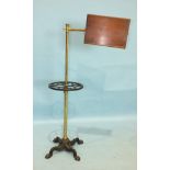 A brass and iron music/reading stand, the adjustable mahogany book rest marked Carters, London.