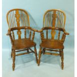 A pair of reproduction elm and beech Windsor armchairs, the solid seats on turned legs, (2).