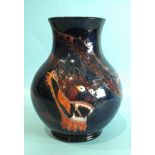 A modern Moorcroft baluster-shaped vase decorated with a dragon on a blue ground, 24.5cm high,
