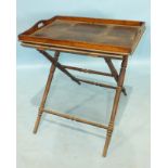 A 19th century oak butler's tray and stand, the tray 70 x 49cm.