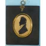 Manners (W H ?) An early-19th century painted silhouette on card of a gentleman, partial trade label