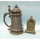 A Continental bronze or brass watch holder of architectural form, cast with arches and caryatid