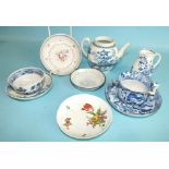 An 18th century Worcester blue and white teapot with oriental decoration, a similar saucer, a