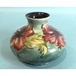 A Moorcroft 'Hibiscus' decorated vase of compressed form, 10.5cm high, small repair to rim of
