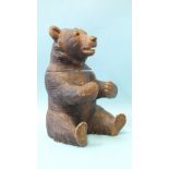 A 19th/20th century carved wood Black Forest tobacco jar and cover in the form of a seated bear,